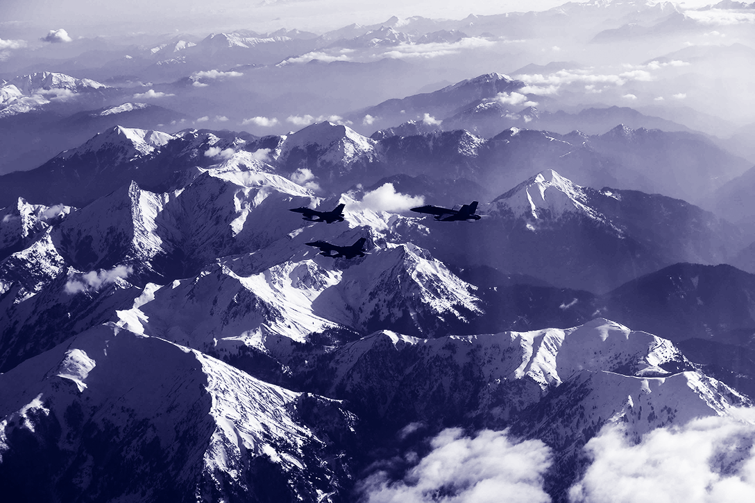 Parachuters jumping out of a plane in the sky.